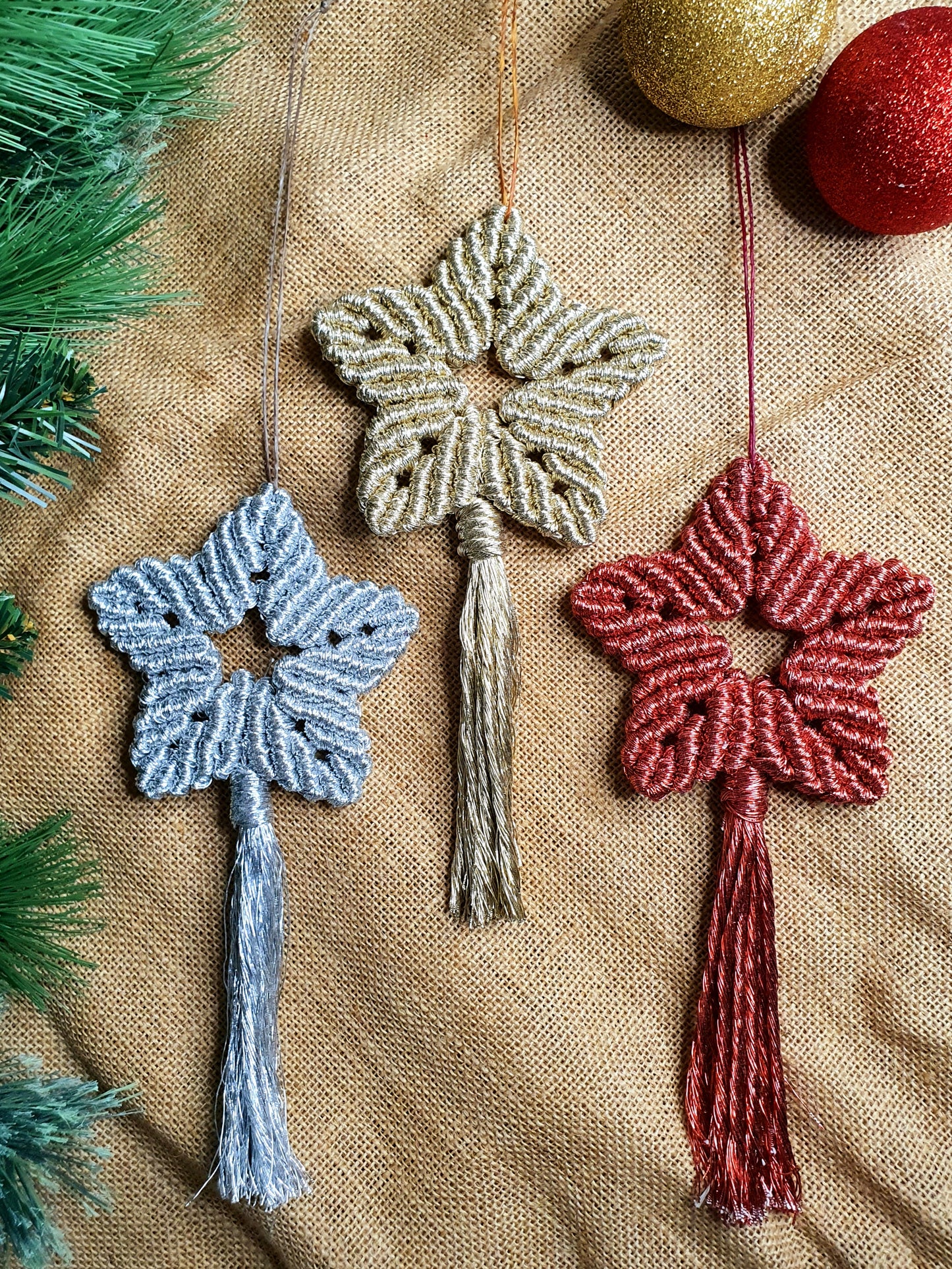 Shiny boho macrame star Christmas hanging baubles, gold silver red Christmas star tree hangings, festive decor, holiday decorations, stars